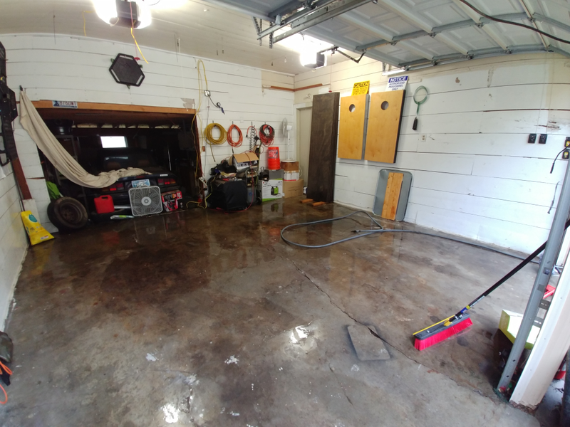 After the initial hose out but before pressure washing